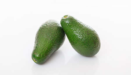 Two avocados isolated on white backgroundの写真素材
