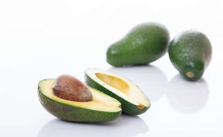 Avocados close up isolated on white backgroundの写真素材