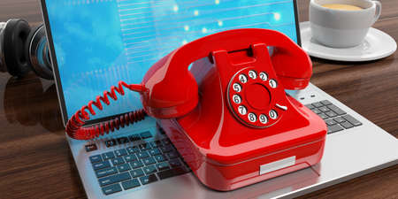 Red old telephone on a laptop on wooden background. 3d illustrationの写真素材