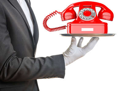 Waiter offering a red old telephone on white background. 3d illustrationの写真素材