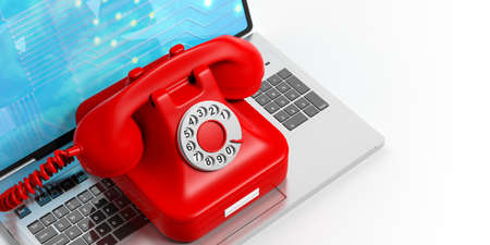 Red old telephone on a laptop on white background. 3d illustrationの写真素材