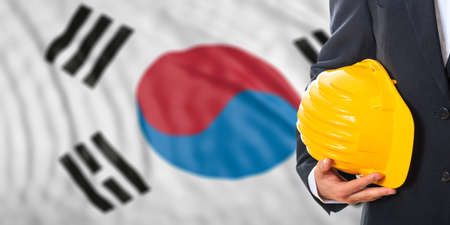 Engineer on a waiving South Korea flag background. 3d illustrationの写真素材