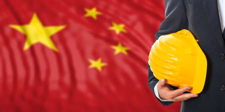 Engineer on a waiving China flag background. 3d illustrationの写真素材