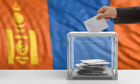 Voter on an waiving Mongolia flag background. 3d illustrationの写真素材