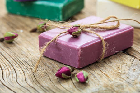 Natural handmade soap bar on wooden background