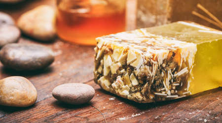Natural handmade soap bar on wooden background