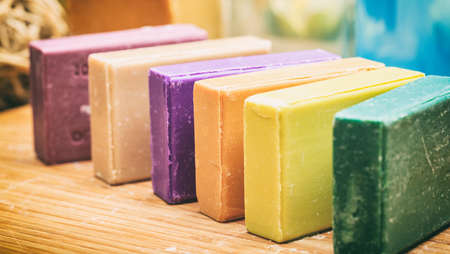 Variety of handmade soap bars on wooden backgroundの写真素材