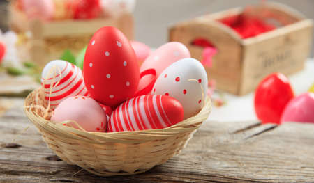 Colorful Easter eggs decoration on wooden backgroundの写真素材