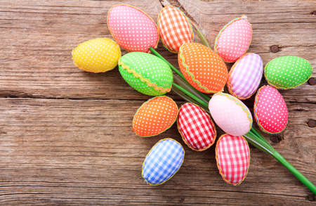 Colorful Easter eggs decoration and copy space on wooden backgroundの写真素材