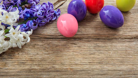 Colorful Easter eggs decoration and copy space on wooden backgroundの写真素材