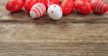 Colorful Easter eggs decoration and copy space on wooden backgroundの写真素材