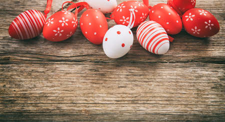 Colorful Easter eggs decoration and copy space on wooden backgroundの写真素材