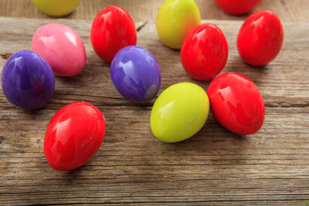 Colorful Easter eggs decoration on wooden backgroundの写真素材
