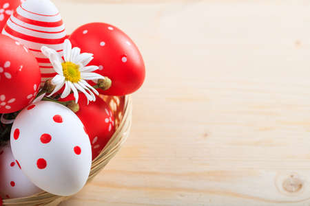 Colorful Easter eggs decoration and copy space on wooden backgroundの写真素材