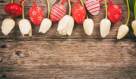Easter eggs on wooden background and copy spaceの写真素材