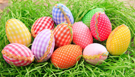 Variety of colorful Easter eggs on grassの写真素材