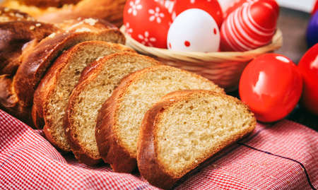 Easter greek tsoureki and eggs on wooden backgroundの写真素材