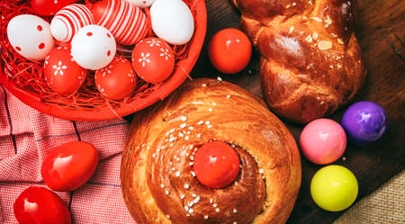 Easter greek tsoureki and eggs on wooden backgroundの写真素材