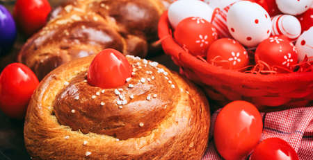 Easter greek tsoureki and eggs on wooden backgroundの写真素材