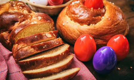 Easter traditional greek tsoureki on wooden backgroundの写真素材