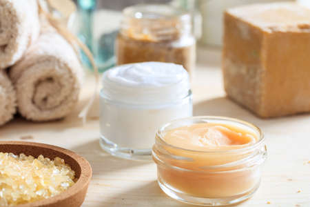 Variety of creams and bath salt on wooden backgroundの写真素材