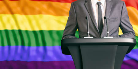 Businessman or politician making speech on gay pride flag background. 3d illustrationの写真素材