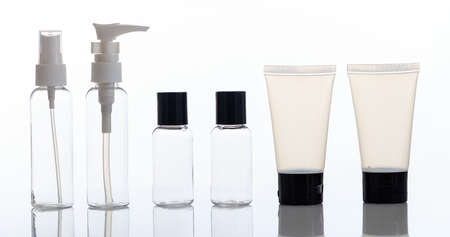 Empty transparent cosmetic bottles and tubes isolated on white backgroundの写真素材