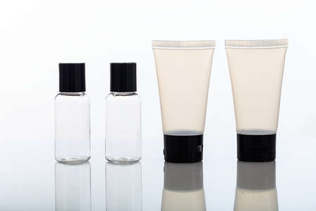 Empty transparent cosmetic bottles and tubes isolated on white backgroundの写真素材