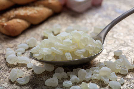 Chios mastic tears in a spoon on a silver backgroundの写真素材
