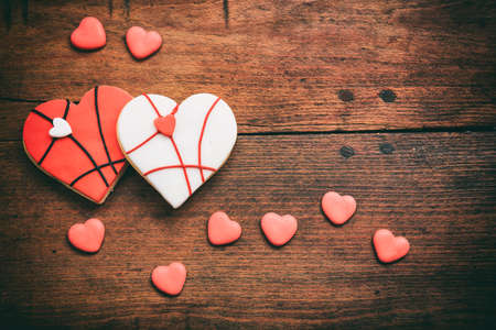 Heart shaped biscuits on wooden background with copy spaceの写真素材
