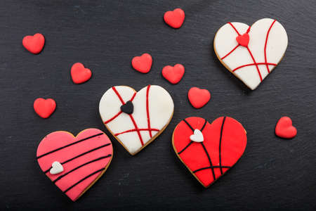 Heart shaped biscuits on a black backgroundの写真素材