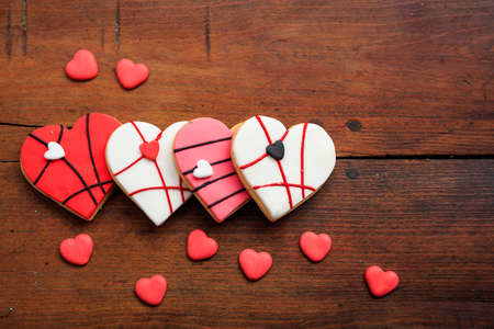 Heart shaped biscuits on wooden background with copy spaceの写真素材