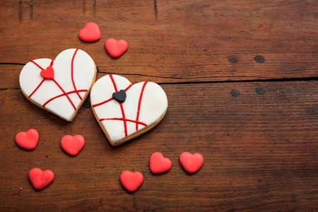 Heart shaped biscuits on wooden background with copy spaceの写真素材