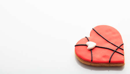 Heart shaped biscuit isolated on white backgroundの写真素材
