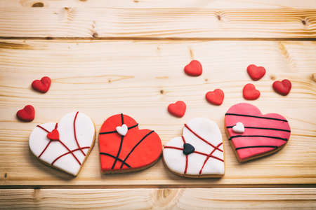 Heart shaped biscuits on wooden background with copy spaceの写真素材