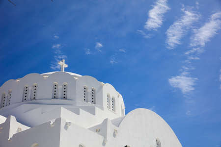 Santorini, Greece - White church on blue sky backgroundの写真素材