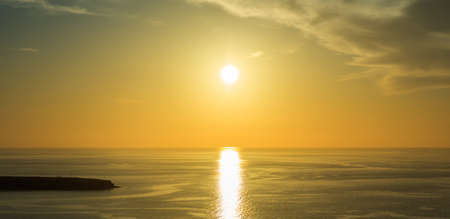 Beautiful sunset over Aegean sea at Santorini island Greeceの写真素材