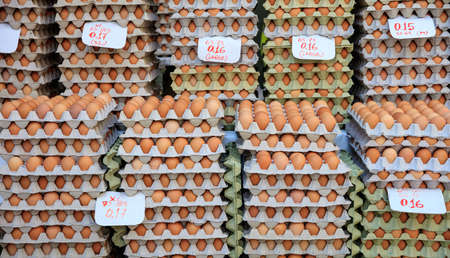 Variety of eggs for sale at an open-air marketの写真素材
