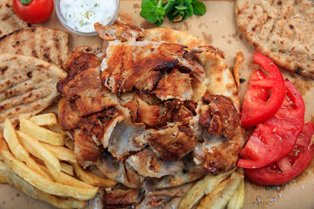Greek gyros dish on a wooden background - top viewの写真素材