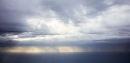 Storm and cloudy sky from a plane window