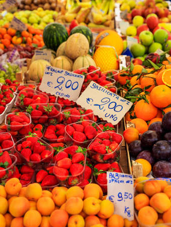 Variety of fruits for sale in an open-air market in Italyの写真素材