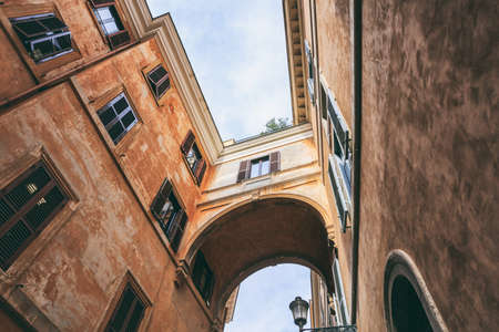 Rome, Italy - Buildings in a narrow streetの写真素材
