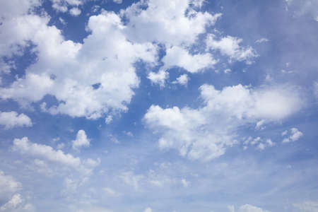 Few clouds on a blue sky backgroundの写真素材