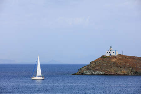 Lighthouse and sailing boat - Greece, Kea islandの写真素材