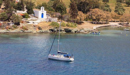 Small church and sailing boat - Greece, Kea islandの写真素材