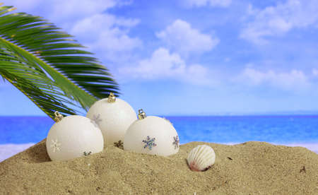 Christmas balls on a sandy beach - copy spaceの写真素材