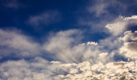 A few clouds on a blue sky backgroundの写真素材