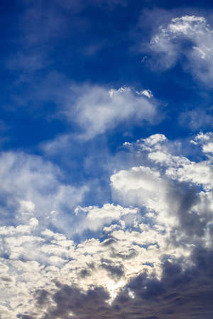 A few clouds on a blue sky backgroundの写真素材