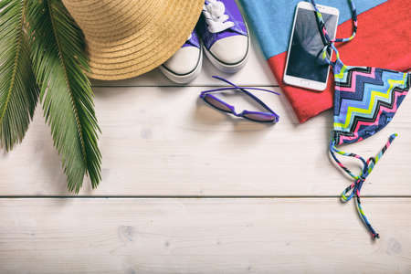 Summer vacation concept on white wooden background - top viewの写真素材