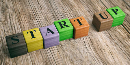 Word Startup on wooden blocks and wooden background. 3d illustrationの写真素材